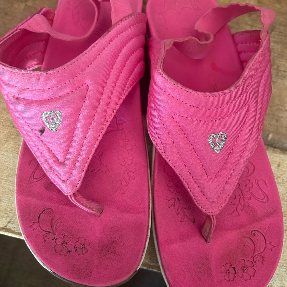 Pink sandals.